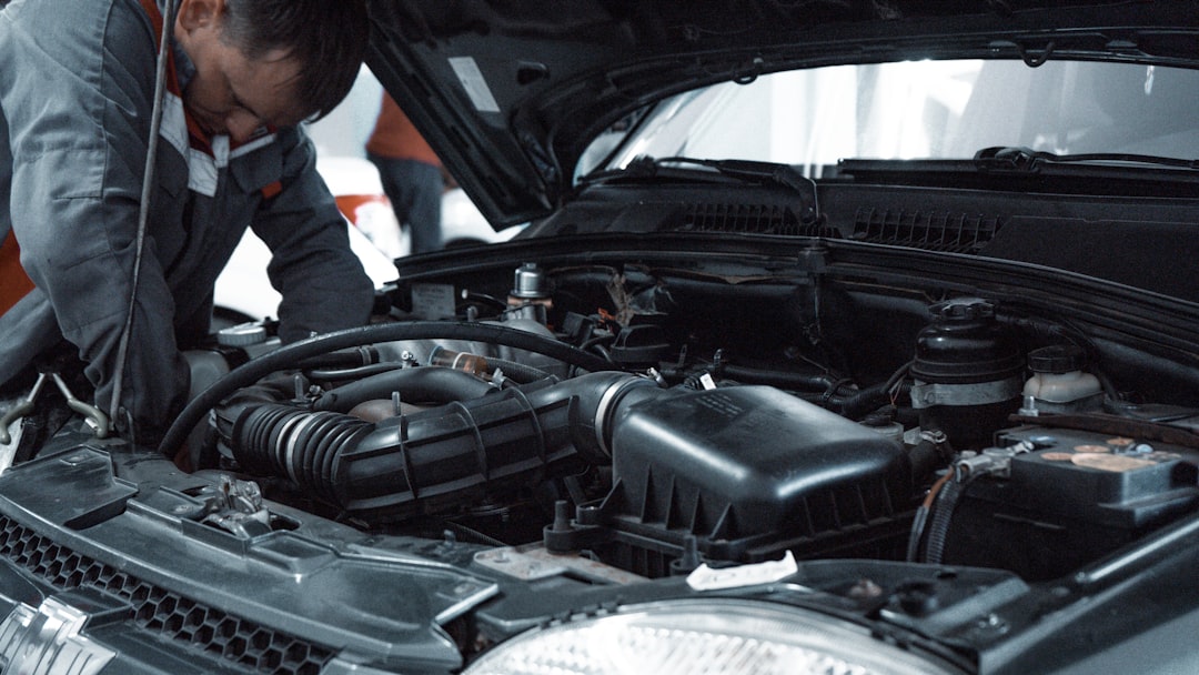 Technician working on a car